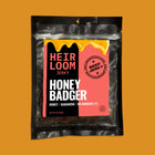 A bag of Honey Badger beef jerky by Heirloom jerky that says the jerky inside is made with honey, habanero, and no badgers (but there's a question mark at the end of the line of flavor indicators). 