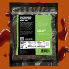 The reverse side of a bag of Sauce Slinger beef jerky that shows the nutritional information, barcode, and ingredients. 